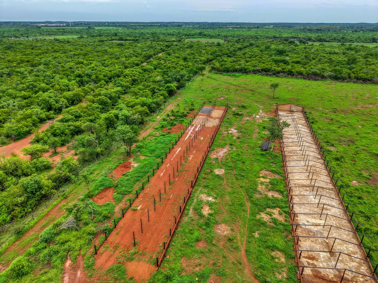 Aerial view of foundation trenches marked out across the cleared Ecomatt Farm site