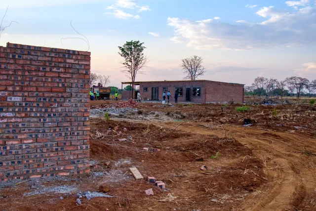 Brick columns and foundations going up at sunset